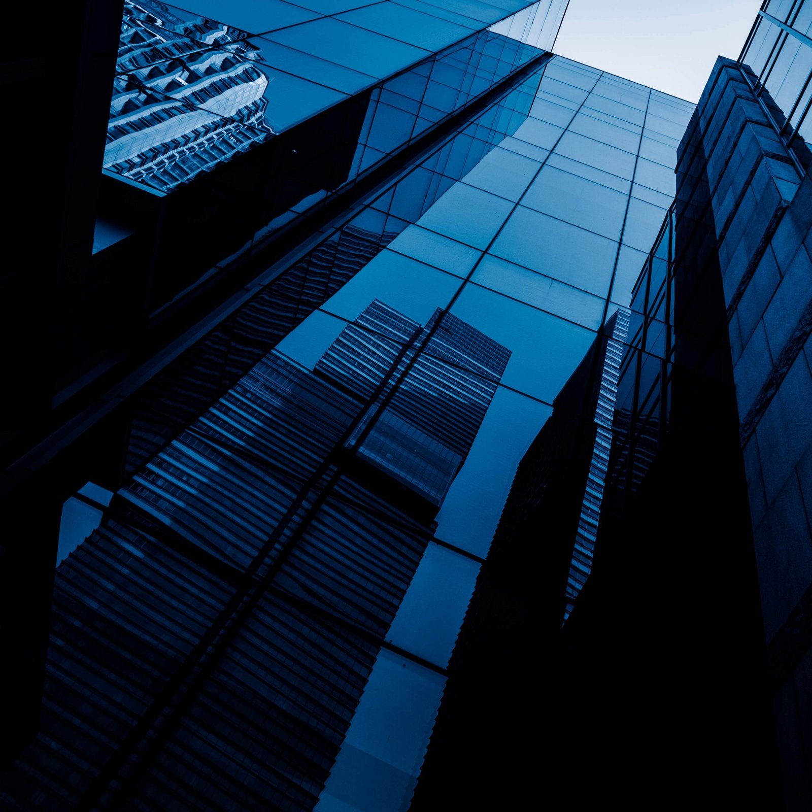 Grade A commercial office towers across the UK skyline at dusk